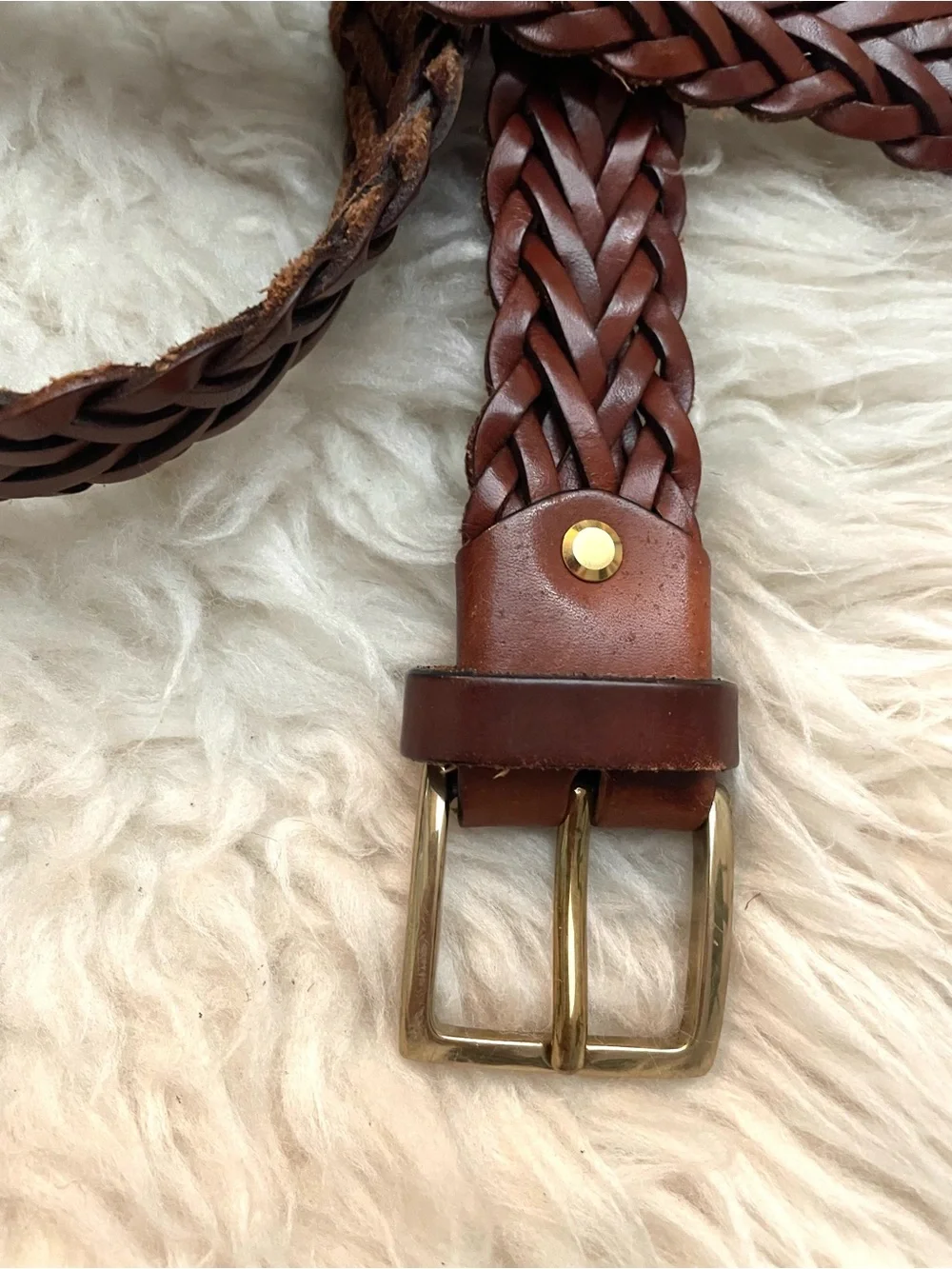 Brown braided leather belt with gold tone buckle. Made in Italy 52” length